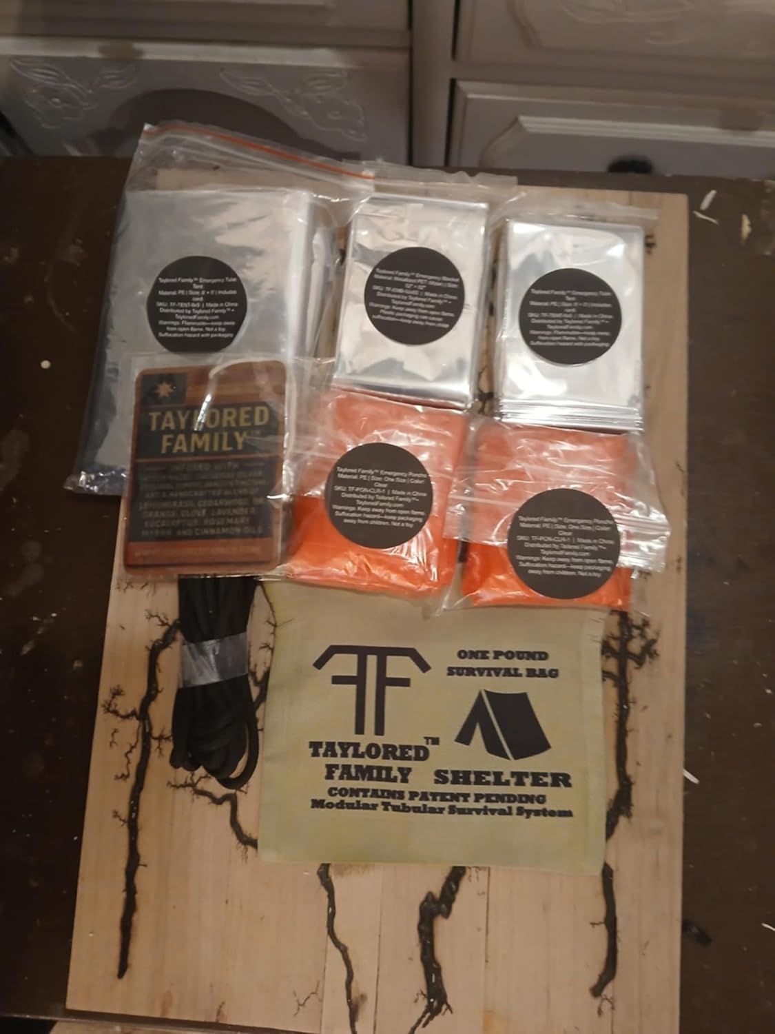 Taylored Family™ Emergency Shelter Kit — Tube Tent (56×96) w/ 14 ft Cord + 2 Emergency Blankets (52×82.5) + 2 Red Rain Ponchos (39.4×50) + 20-ga Utility Shell (Matches & Line)